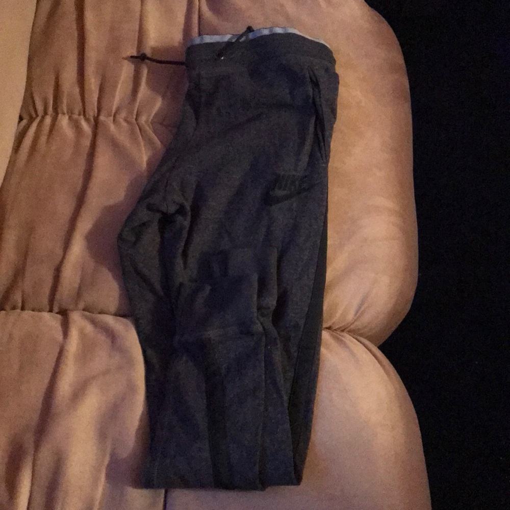 dark grey Nike joggers with pockets